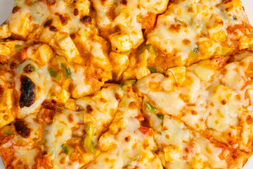 Indian Style of Italian Dish Paneer Pizza Topped with Cottage Cheese