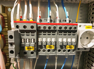 close-up of an electrical cabinet with controls and automation. Electrical contactor, electrical wires. Industrial electrical panel with contactors, socket and wires. Selective focus