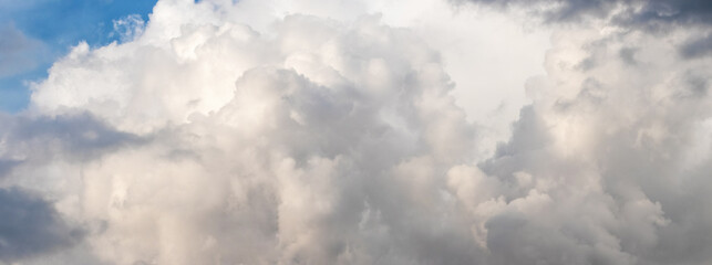 Panorama of the sky with white cumulus clouds