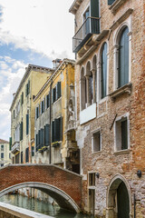 Beautiful view of Traditional Venetian buildings along a water channel, Venice, Italy, Europe.