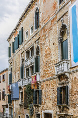 Fototapeta premium Beautiful view of Traditional Venetian buildings along a water channel, Venice, Italy, Europe.