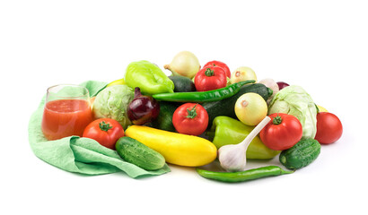 Composition of ripe fresh vegetables and a glass of vegetable juice on a white background with water drops. Food background. Side view. The concept of natural products, proper nutrition.
