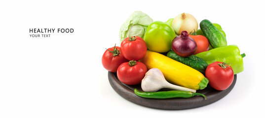 Washed fresh vegetables in a large assortment on a white background with space for copying and an inscription above the vegetables. Food background, panorama. The concept of proper nutrition.