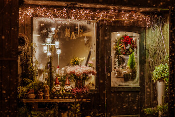 The wooden porch of the store decorated with Christmas decoration