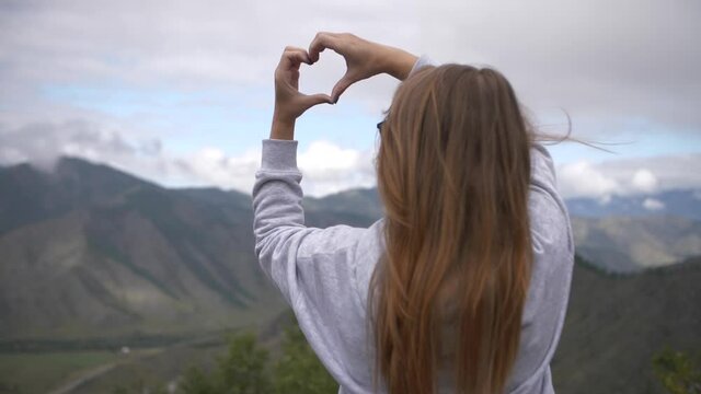 footage of woman on the background of mountains