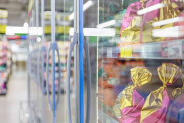 Showcases with frozen foods in a supermarket. Side view. Close-up.