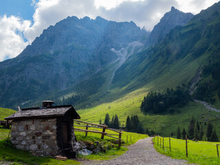 An old traditional meat smoker in the austrian alps on a sunny day.