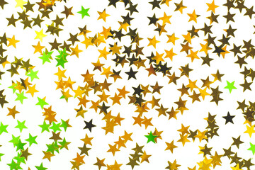 Festive background. Shining golden stars on white background. Christmas. New Year. Birthday  