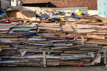 Pile of folded cardboard and paper box stored for recycle