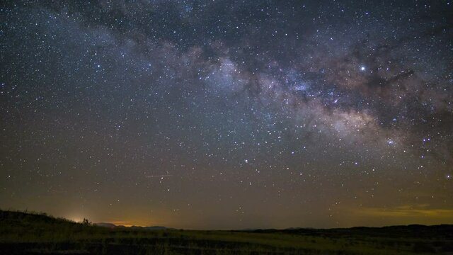  Astro timelapse of Milky Way galaxy rising over wildflowers in Mojave Desert in California