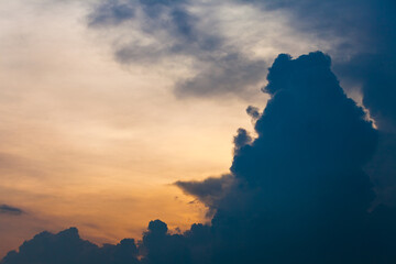The silhouette of a big cloud with a beautiful sunset