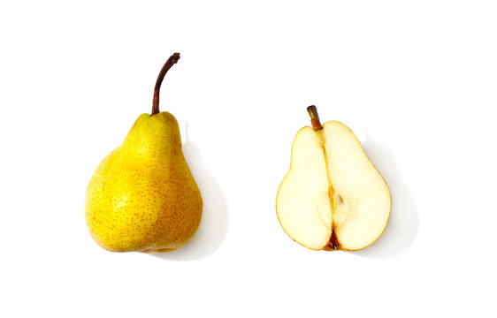 Whole pear next to a halved pear