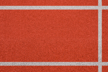 Top view of the running track rubber lanes cover texture with white line marking for background.