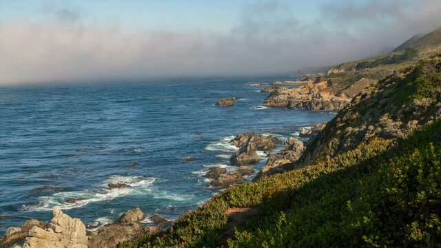  Timelapse of coastal fog rolling in at rugged coastline in Central California