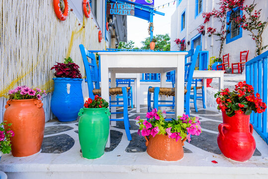 Kos island, Kos town, Greece - May 17, 2016: traditional Greek restaurant (tavern), decorated with flowers, in the old town of Kos