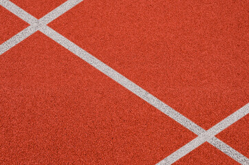 Top view of the running track rubber lanes cover texture with white line marking for background.