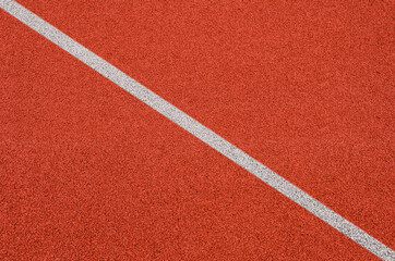 Top view of the running track rubber lanes cover texture with white line marking for background.