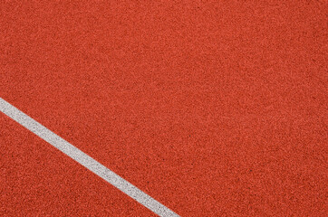 Top view of the running track rubber lanes cover texture with white line marking for background.
