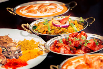assorted indian curry and rice dishes shot from overhead composition
