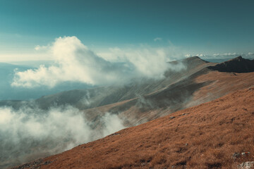 Amazing clouds landscape on the mountain in autumn season 