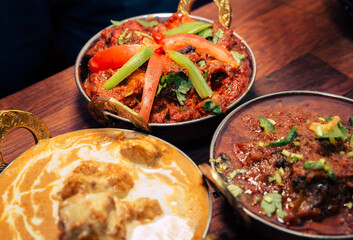 assorted indian curry and rice dishes shot from overhead composition
