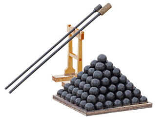 A pyramid of black cannonballs on a white