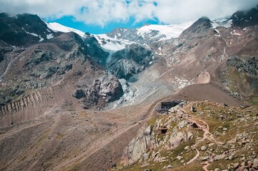 An isolated mountain refuge in the middle of the valley in the italian Alps (Trentino, Italy, Europe)