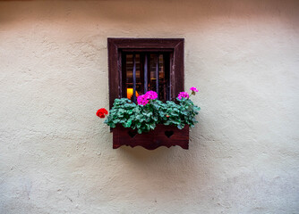 Fototapeta na wymiar The colorful facades of the houses of the village of Riquewhir, in Alsace, France,