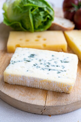 Cheese collection, French fol epi  cheese with many little holes, etorki, tomme noire des pyrenees and ossau iraty cheese