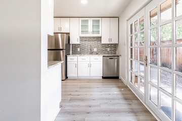 New modern kitchen in an apartment with stainless steel appliances. Real photo