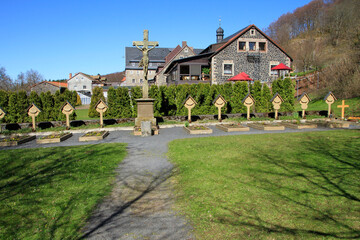 Fototapeta na wymiar Ruhestaette der Moenche auf dem Klosterfriedhof des Kreuzberger Klosters. Rhoen, Bischofsheim, Bayern, Deutschland, Europa