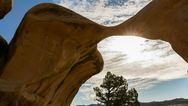  Time lapse tracking shot of Metate Arch at Devils Garden in Grand Staircase Escalante National Monument in Utah