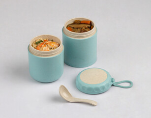 tiffin box carrier with soup and shrimp fried rice isolated on white