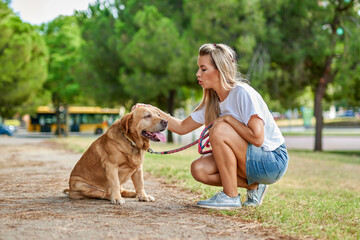 Woman training dog at the park