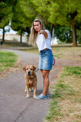 Woman training dog at the park