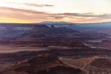 view of the valley in the red rocks desert on a sunrise