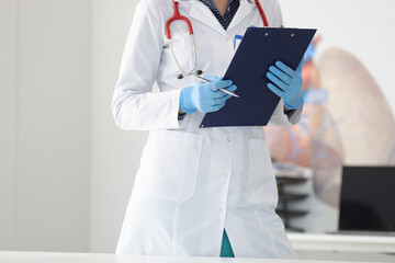 Doctor in white coat and gloves holds pen and clipboard. Distance medical consulting concept