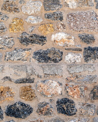 random cut stone wall closeup, natural textured background