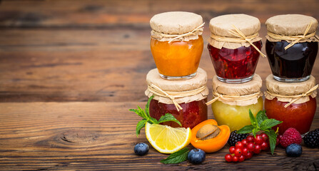 Various homemade fruit jam in the jars
