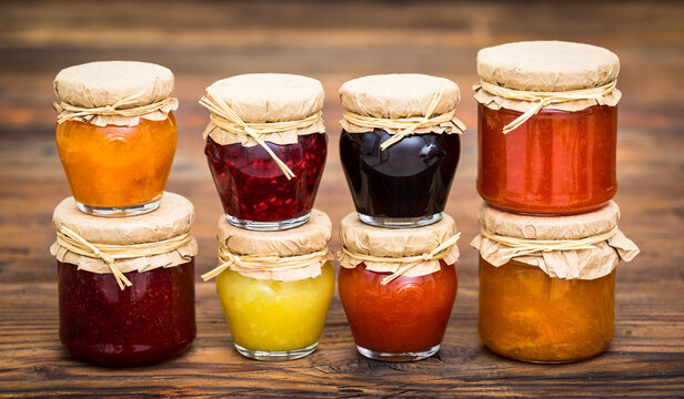 Various homemade fruit jam in the jars
