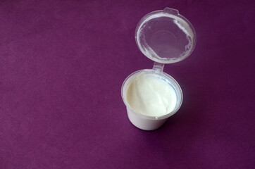 Opened jar of white cream for body and face care