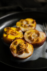 Baked apricots with coconut milk and nuts 