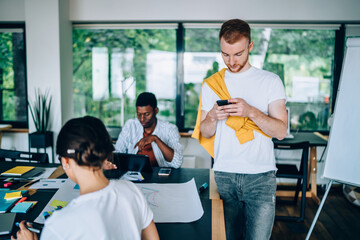 Multiracial coworkers working in office