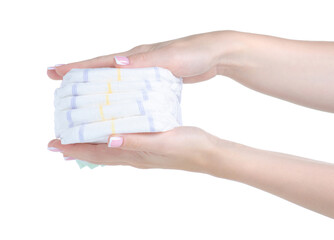 Stack baby diapers in hand on white background isolation