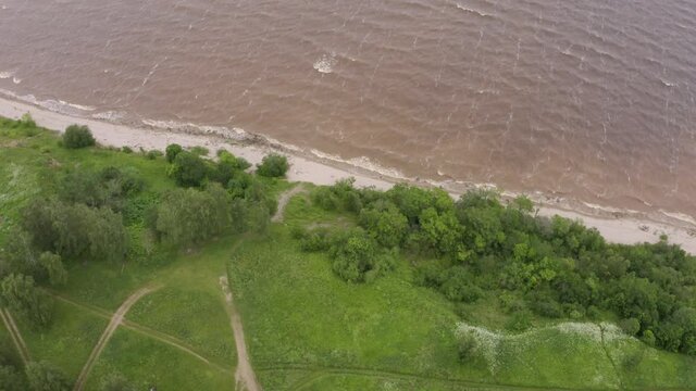 Panoramic aerial view of Lake Ilmen near Veliky Novgorod, natural attractions of Russia. Strong wind and waves on a sunny summer day.
