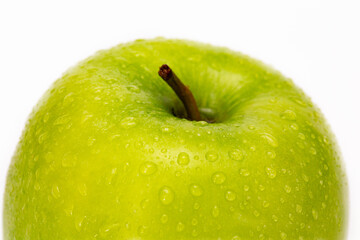 green apple with drop of water isolated on white