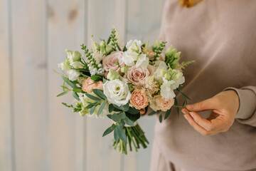 Large Beautiful bouquet of mixed flowers in woman hand. Floral shop concept . Beautiful fresh cut bouquet. Flowers delivery