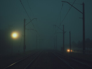 Fototapeta na wymiar Foggy early morning on the railroad