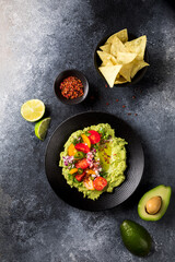 Guacamole is a Traditional Mexican Sauce with Nachos.Vegetarian dish.