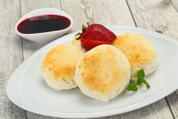 Curd pancakes with jam and stravberry